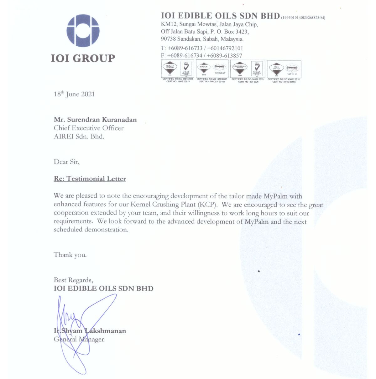 A crop of the IOI Edible Oils letter of 18 June 2021, from the letterhead down to the signature: the IOI Group roundel and wordmark, the Sandakan address and a row of four certification marks, the date, the addressee Mr. Surendran Kuranadan, Chief Executive Officer, AIREI Sdn. Bhd., the underlined heading Re: Testimonial Letter, the five-line body paragraph, and a large blue ink signature over the name Ir. Shyam Lakshmanan, General Manager.