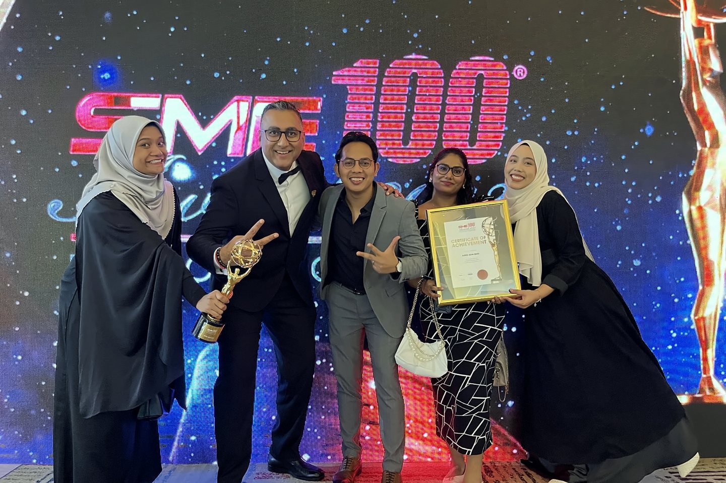 AIREI receiving the SME100 award